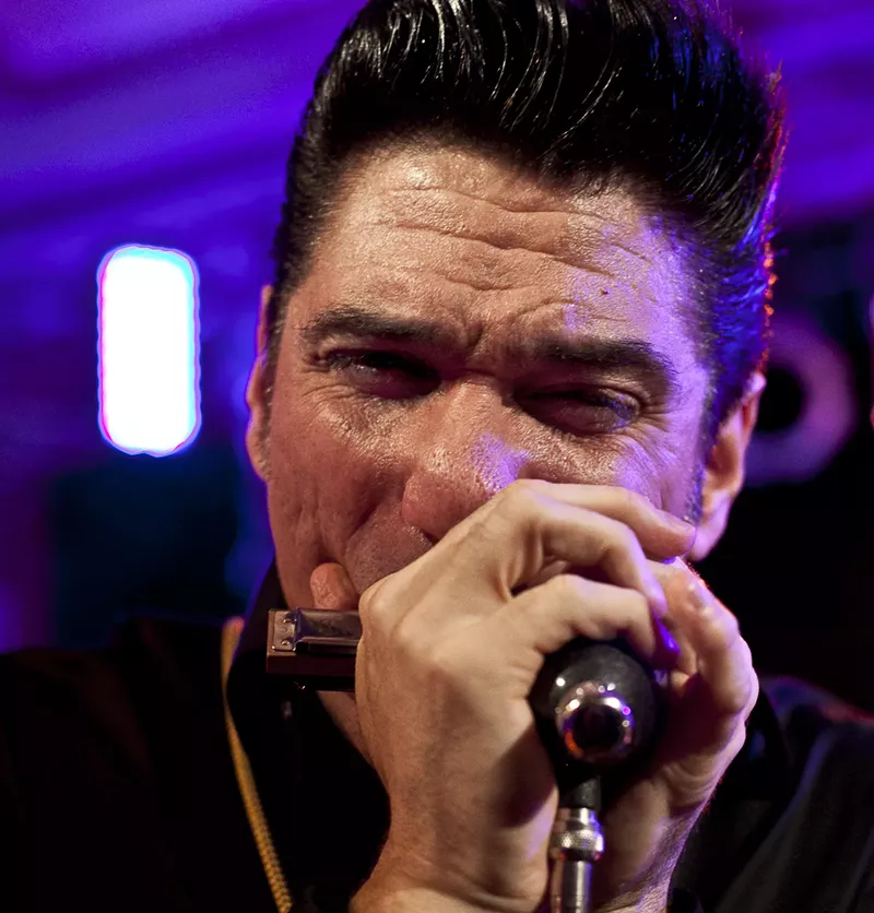 Image: Bob Corritore working the harmonica.