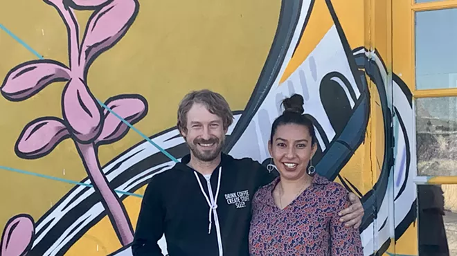 two people pose for a picture