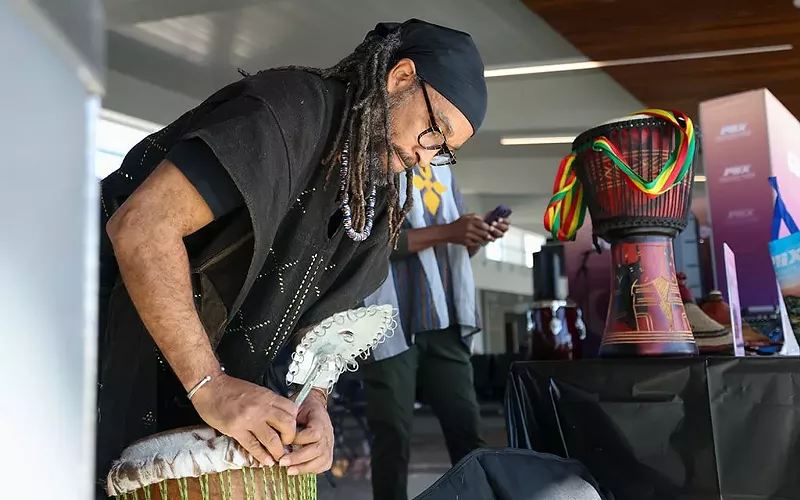 Image: Jumoke’ Farrow sets up his hand drum during the Black History Month edition of the Culture Corner at Phoenix Sky Harbor International Airport in Terminal 3 on Feb. 10, 2025.