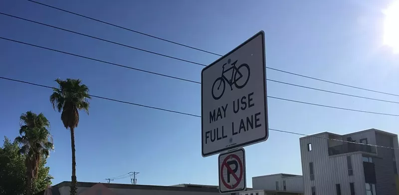 Image: A sign indicating a bike path at West Roosevelt Street and Seventh Avenue.