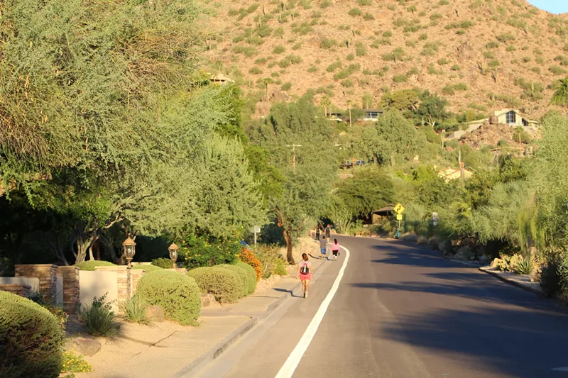 Image: Hikers on Cholla Lane headed toward the Cholla Trail trailhead.