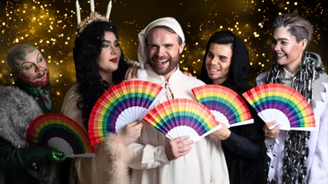 A group of people in old-fashioned clothing holding rainbow-colored fans.
