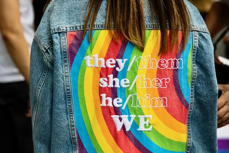 Image: rainbow flag jacket with pronouns