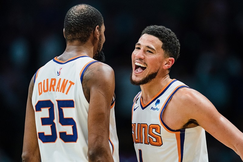Devin Booker (right) and Kevin Durant (left) rank first and third, respectively, among Phoenix's highest-paid athletes.