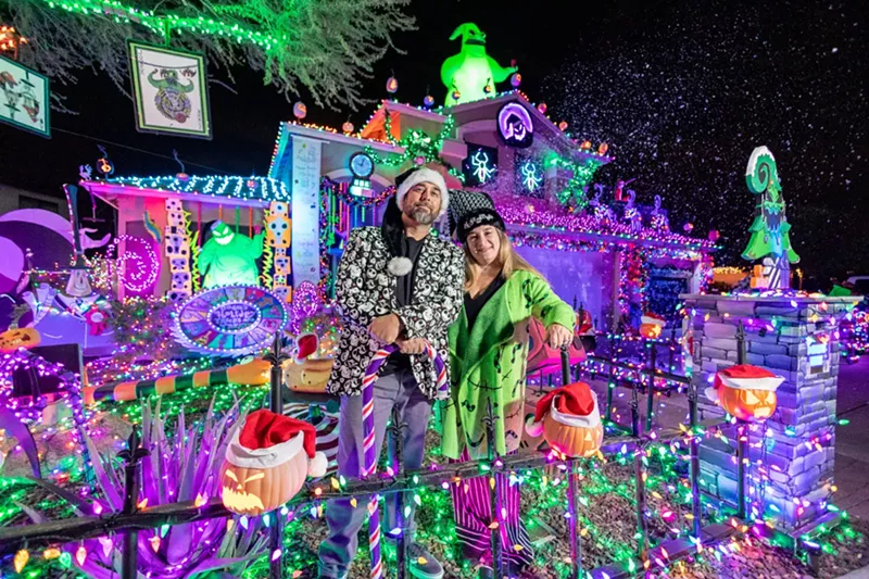 Image: Bob Spacy Jr., left, and Sheri Spacy, right, in front of the Scary Christmas House in Glendale.