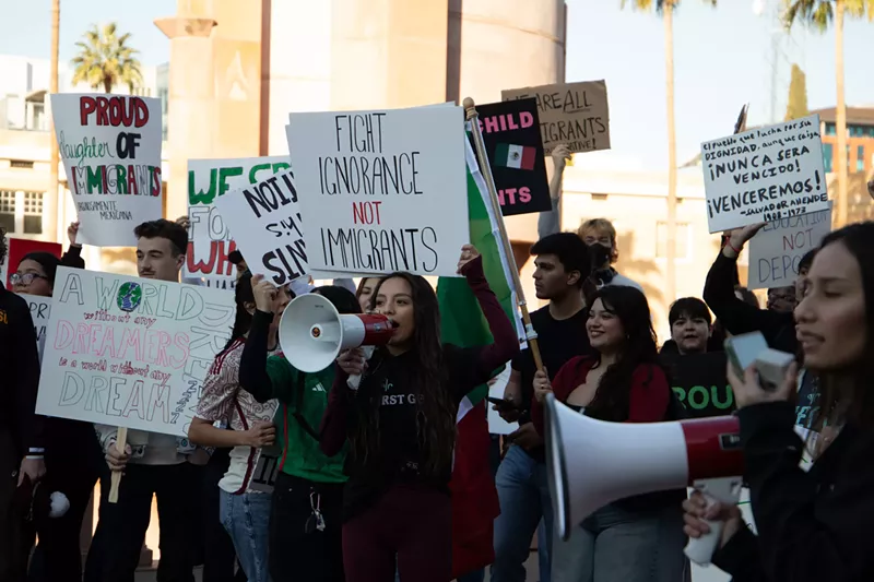 Image: protesters hold up pro-immigrant signs