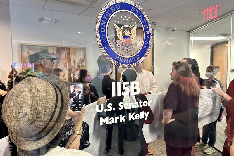 Protesters converged on Sen. Mark Kelly's office on Tuesday, calling for the Arizona senator to support a ceasefire in Gaza.