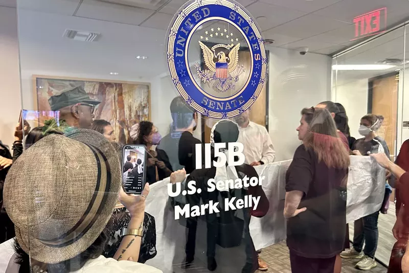 Image: Protesters converged on Sen. Mark Kelly's office on Tuesday, calling for the Arizona senator to support a ceasefire in Gaza.