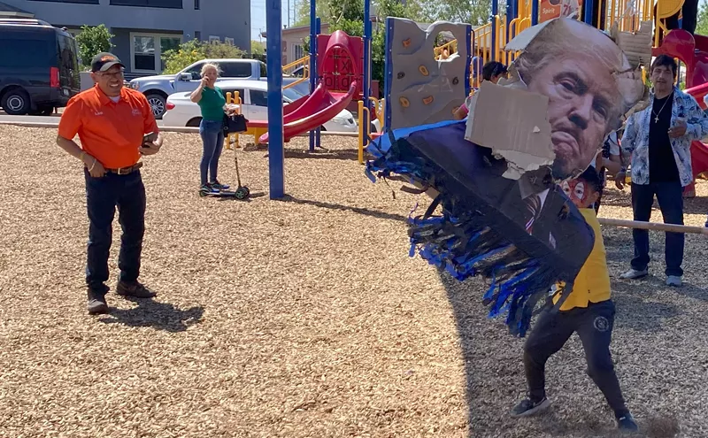 Image: Protesters mark El Día del Niño by bashing Trump and Musk piñatas