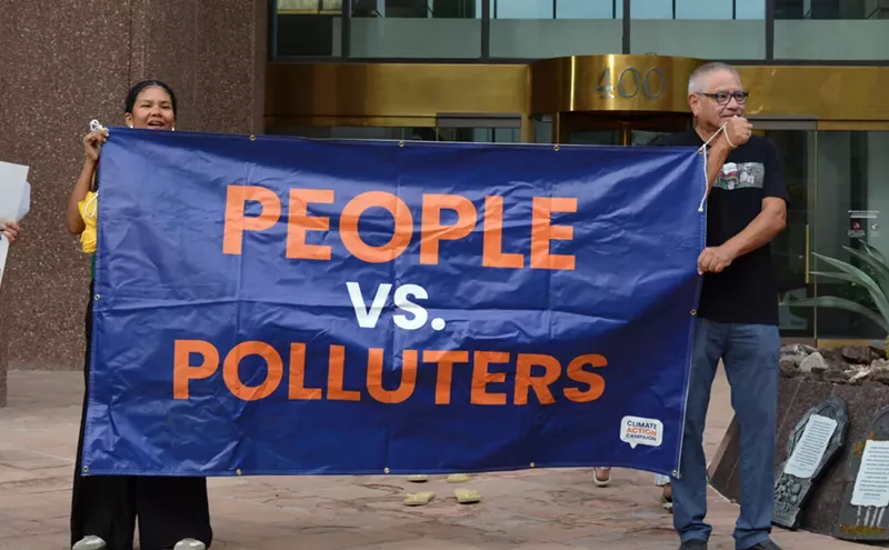 Image: Protesters slam APS for raising rates, ditching clean energy