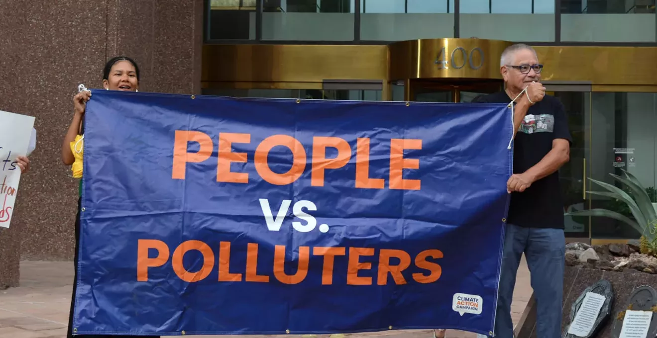 Image: Protesters slam APS for raising rates, ditching clean energy