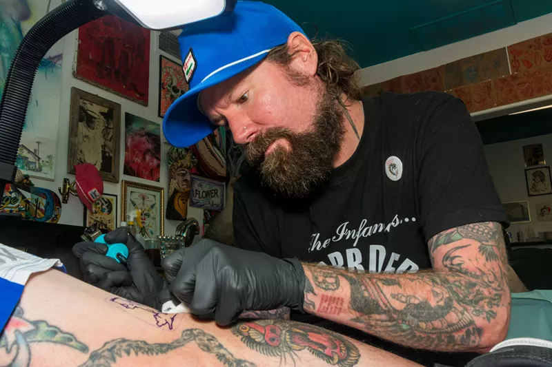 Image: Luke Goodell works on a client.