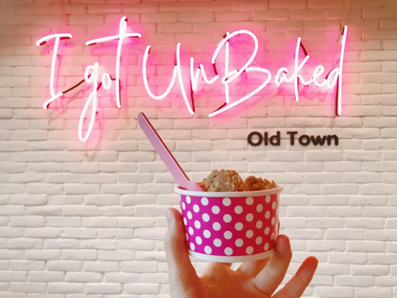 Image: A highly photogenic neon wall greets customers at Unbaked in Old Town Scottsdale.