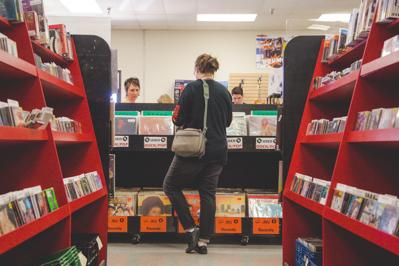 Customer browsing at Zia Record Exchange on Mill Avenue.