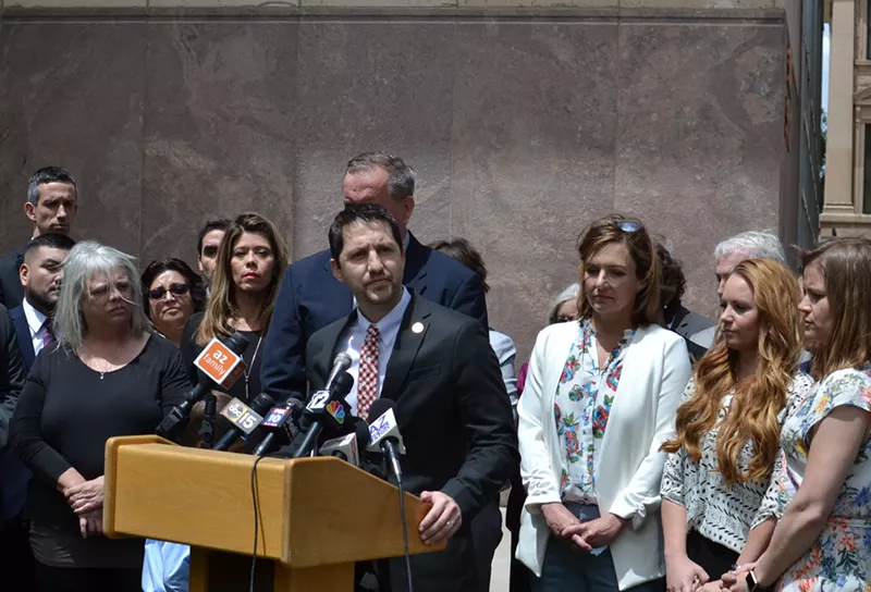 Image: State Senator Paul Boyer, center, speaks in May about bills to extend the civil statute of limitations for survivors of childhood sexual abuse.