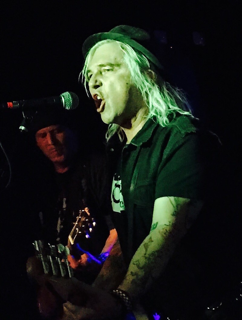 Steve Davis performing with the U.S. Bombs, with bandmate Dave Barbee in the background.