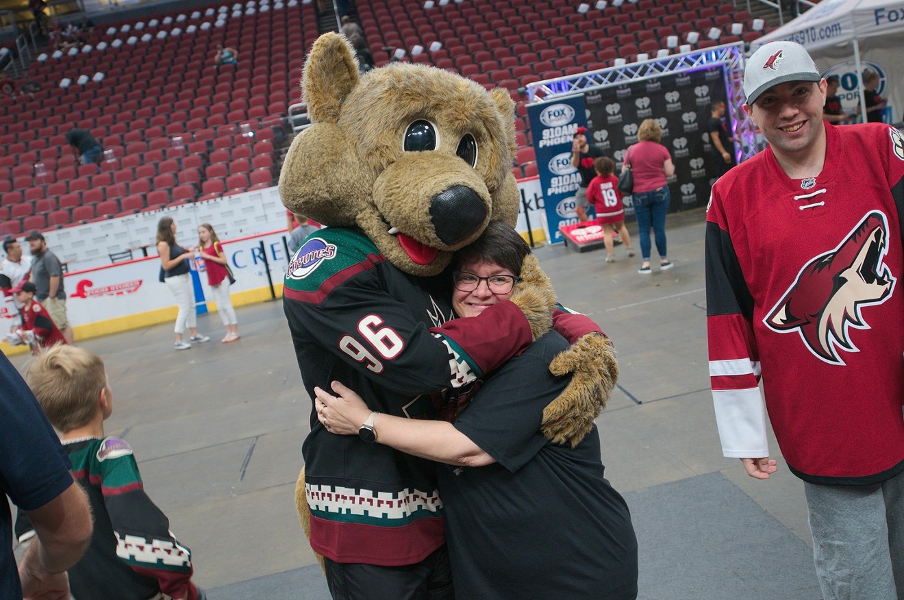 Howler the Coyote hugs it out during the Arizona Coyotes' Fan Fest in 2019 at Desert Diamond Arena.