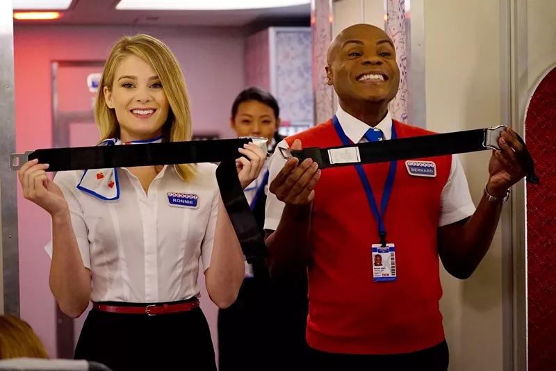 Image: Kim Matula (left) and Nathan Lee Graham are two of the "stars" in LA to Vegas, a workplace comedy about a flight crew that regularly travels the cursed route between the two title towns.