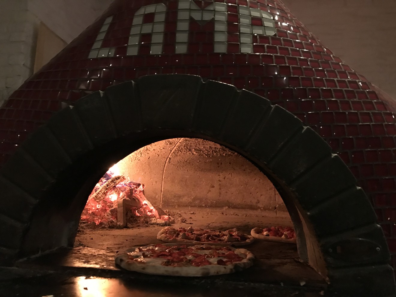 The LAMP red brick oven is like a lighthouse in the restaurant.