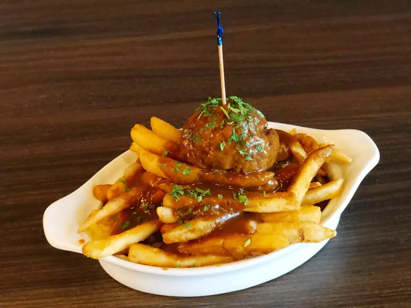 Image: The poutine at Meatballz Inc. comes with a meatball of choice on top of sturdy fries covered in rich mushroom gravy and cheese curds.
