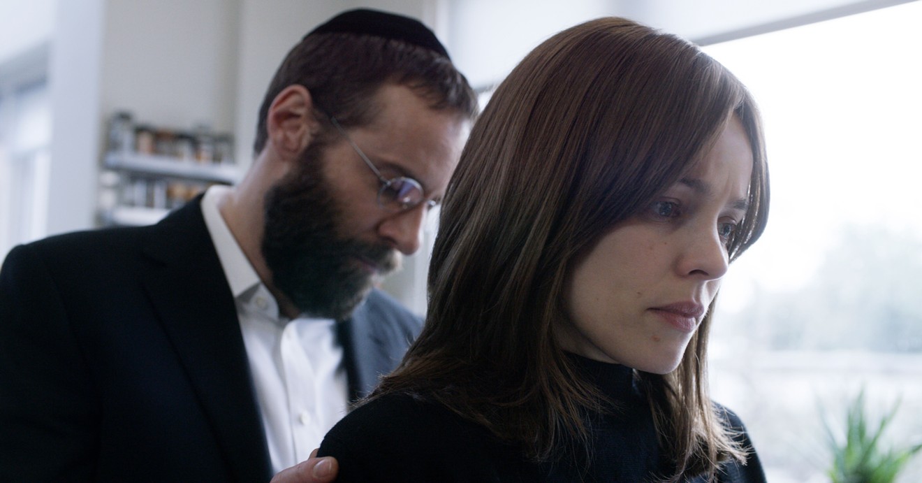 Alessandro Nivola (left) and Rachel McAdams play a husband and wife whose marriage might be threatened after they welcome the return of an old friend in Disobedience, the first English language film by Sebastian Lelio.