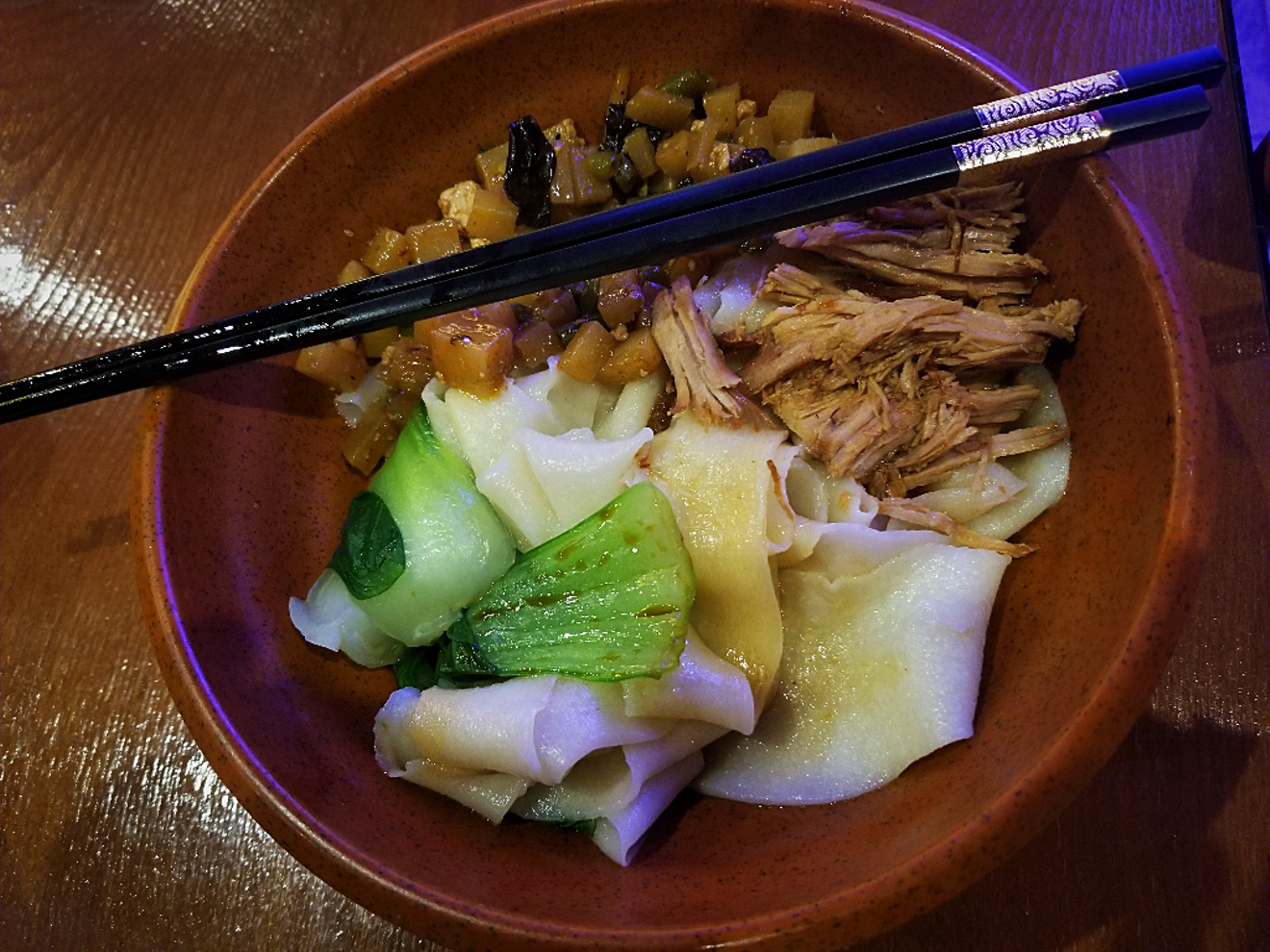 Thick biangbiang noodles with pork and veggies are a signature specialty at Shaanxi Chinese Restaurant in Mesa.