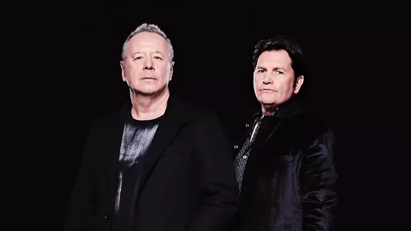 Image: Two band members pose for picture.