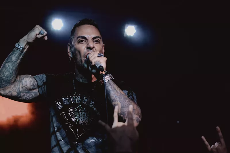Image: One of those tattoos commemorates the first metal concert Jose Mangin attended in metro Phoenix.