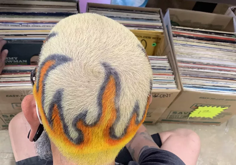 Image: Music fan Charlie Von Moonshine digs through vinyl at The Record Room.