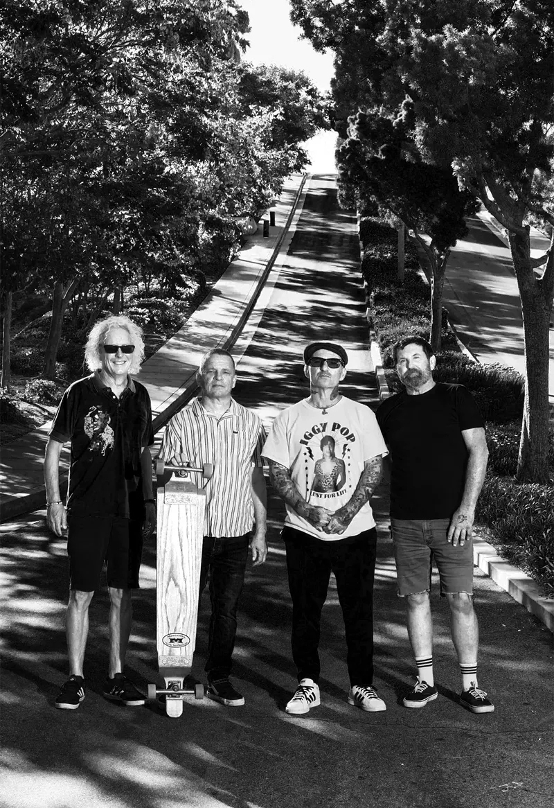 Image: Don "Redondo" Pendleton, Brian Brannon (holding the long board), Jamie Reidling, and Corey Stretz are JFA and they have a killer new record out called Last Ride.