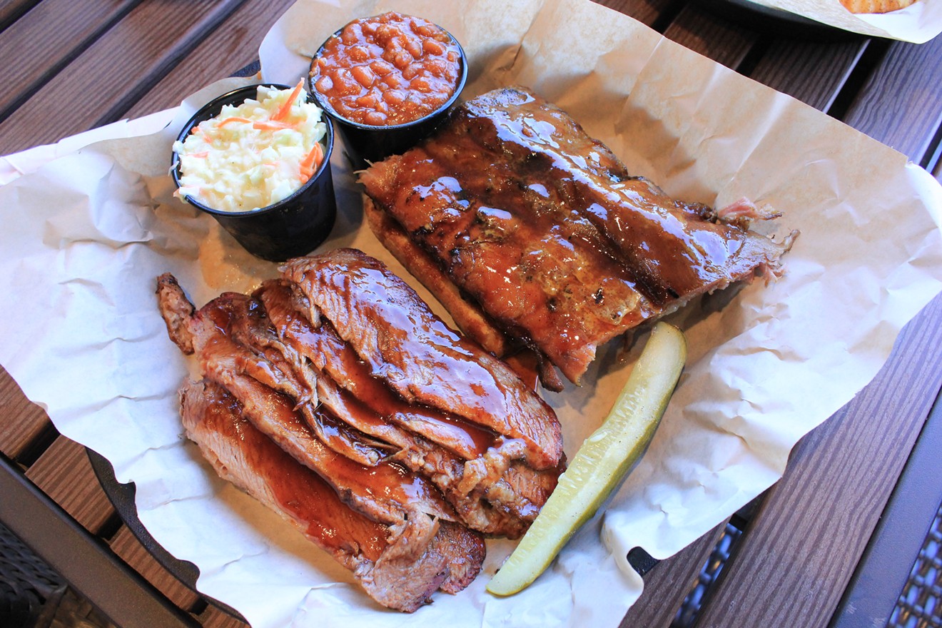 Ribs and brisket smoked over almond wood in West Alley's concrete pit