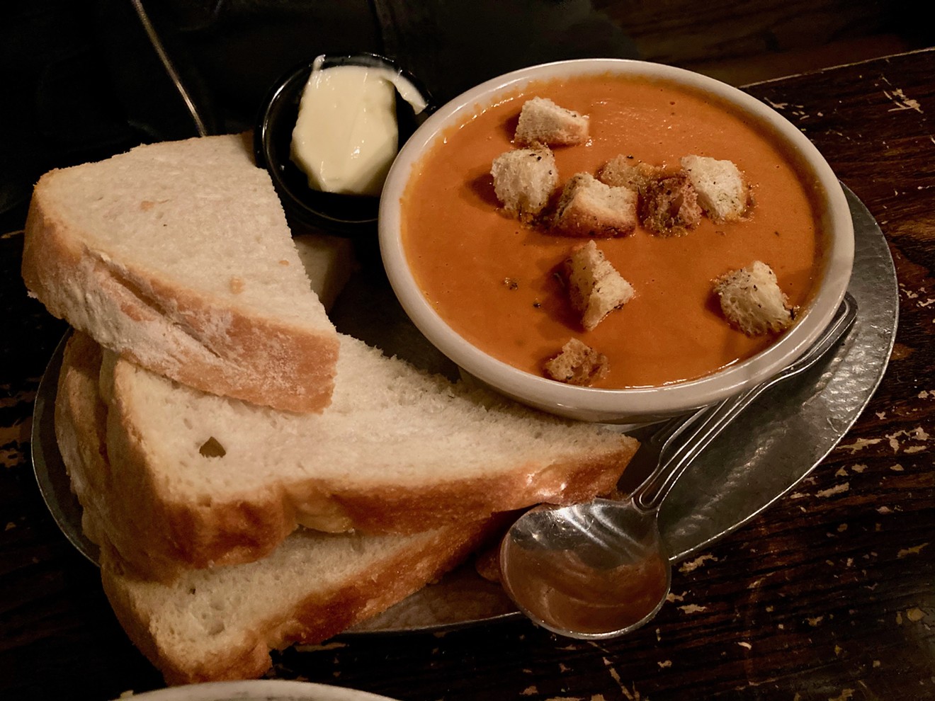 The cream of tomato soup with croutons and housemade bread at Cornish Pasty Co.
