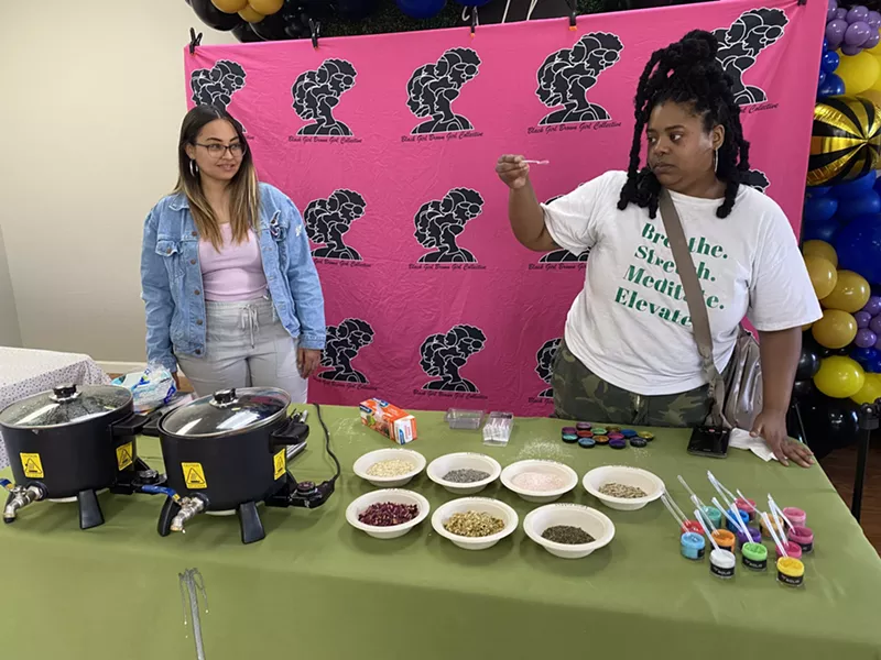 Image: Britney Kelly watches as Morgan Polk of Polk Apothecary explains soap making at a Black Girl Brown Girl Collective workshop in February.