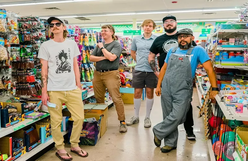 Image: Members of band Playboy Manbaby inside a store