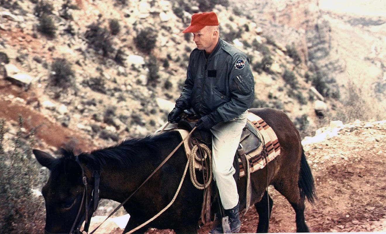 Neil Armstrong rides a burro while training in the Grand Canyon in 1964.