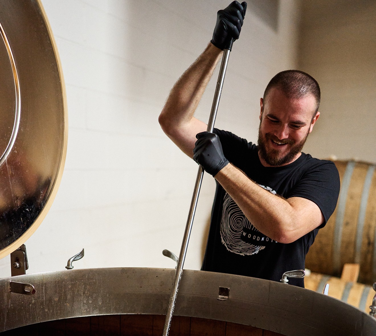 Arizona Wilderness Brewing Co. Wood Notes Cellar Manager Nick Pauley crushes grapes for a wine-beer hybrid the brewery makes for Terroir Festival.