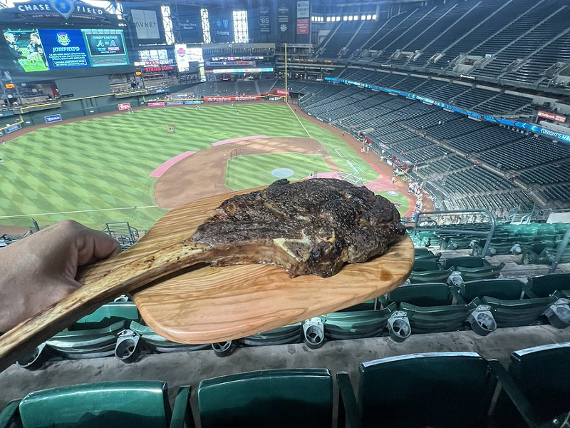 Image: Dedicated Arizona sports fan Nathan Kropp brings his own food to Chase Field.
