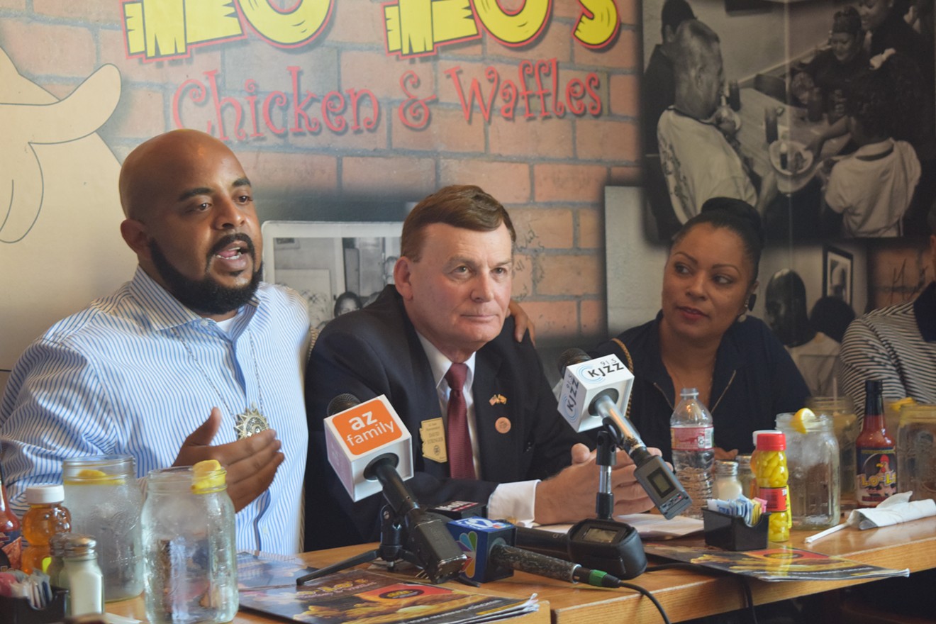 Jarrett Maupin, left, and David Stringer, center, at Lo-Lo's Chicken and Waffles.