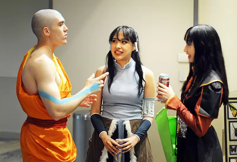 Image: A group of "Avatar: The Last Airbender" cosplayers talking at Phoenix Fan Fusion 2024.