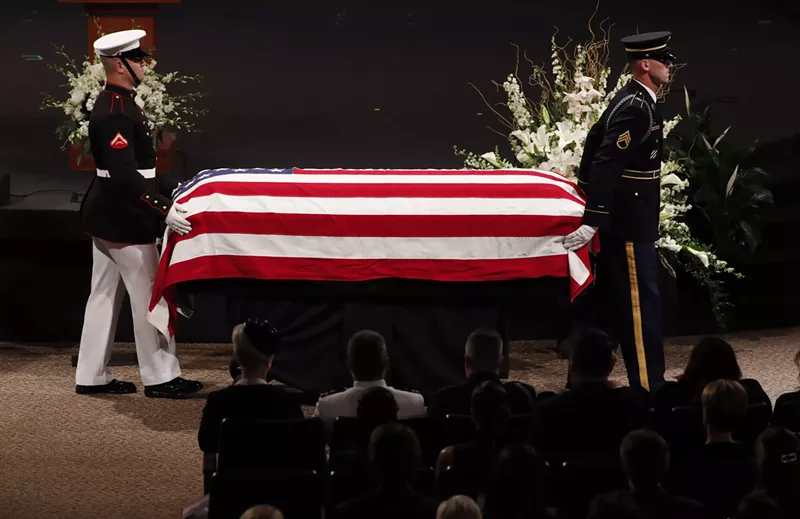 Image: Members Arizona National Guard Casket Team take John McCain out of North Phoenix Baptist Church on Thursday. He will be buried Sunday, September 2, in Annapolis, Maryland.