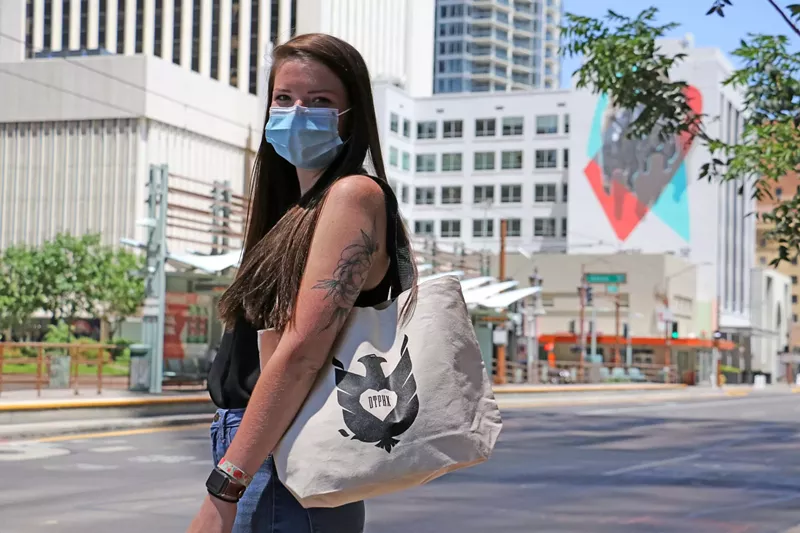 Image: DTPHX "bird" tote bag — hence the whole Buy & Fly program name.