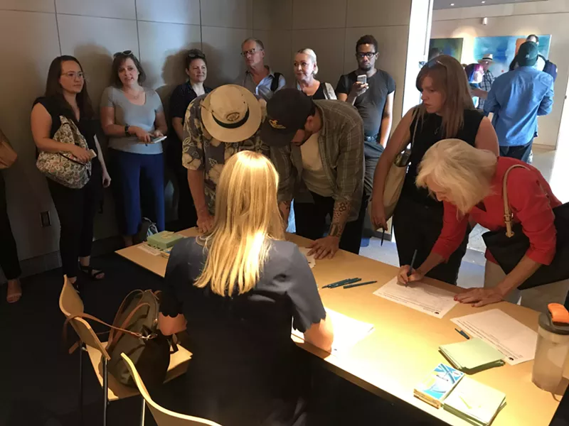 Image: People who wanted to speak filled out comment cards when they arrived.