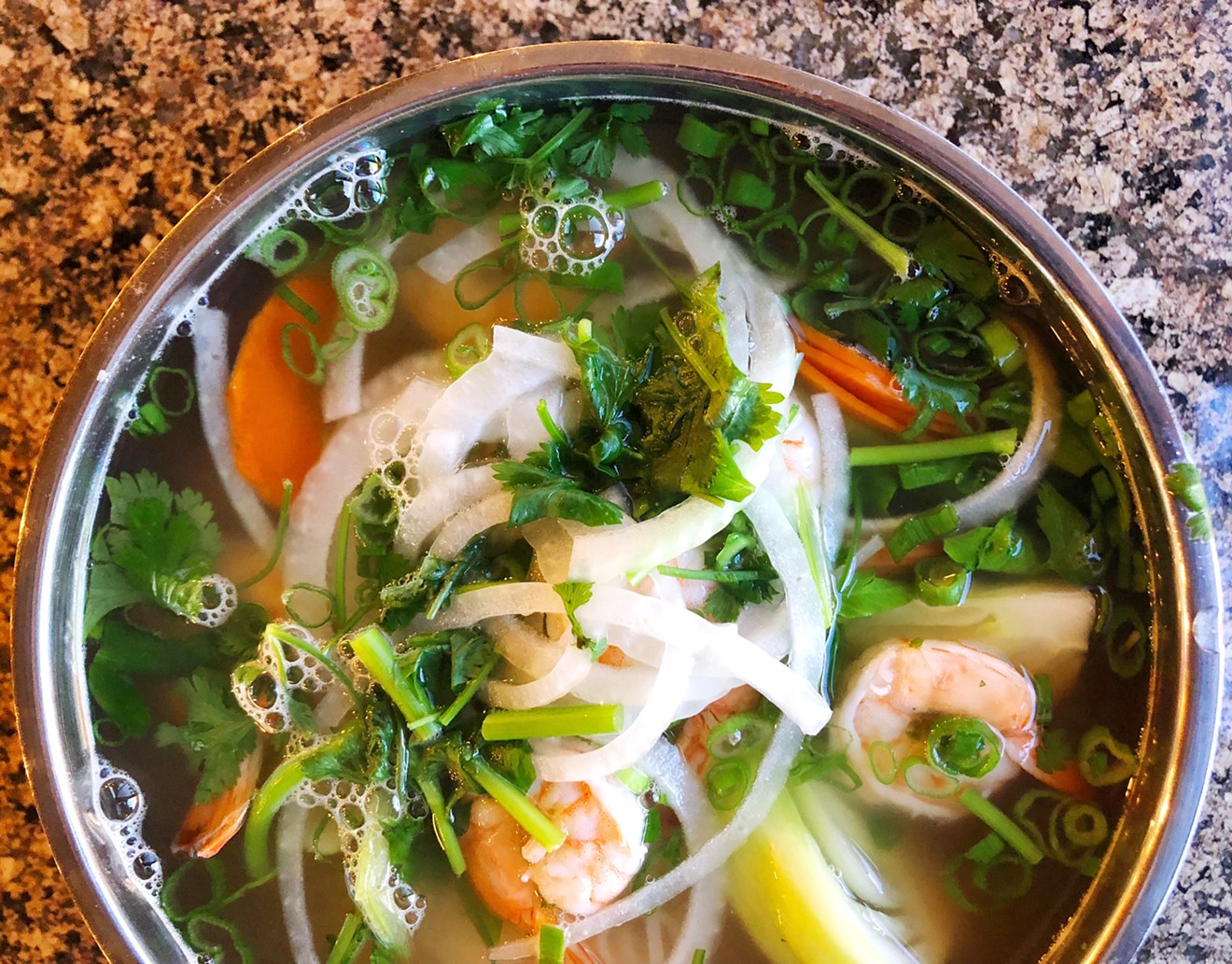 The shrimp pho is packed with carrots, bok choy, onions, and cilantro in a choice of beef or vegetable broth.
