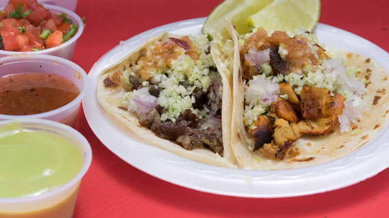 Image: Each taco comes with minced cabbage and onion, plus a mild, smoky red salsa.