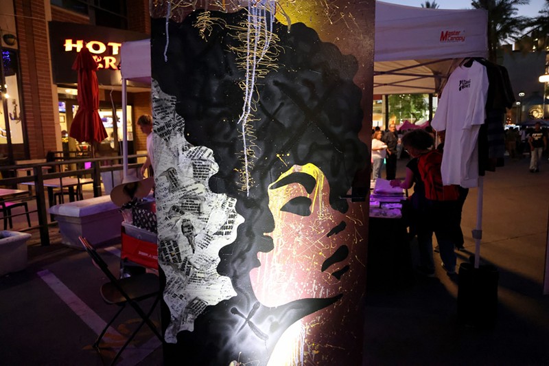 The door that represents the future in The Doorways installation has a graffiti-style background and a silhouette of a Black woman with an Afro. Photo taken at the Juneteenth Block Party on June 15 in Tempe.