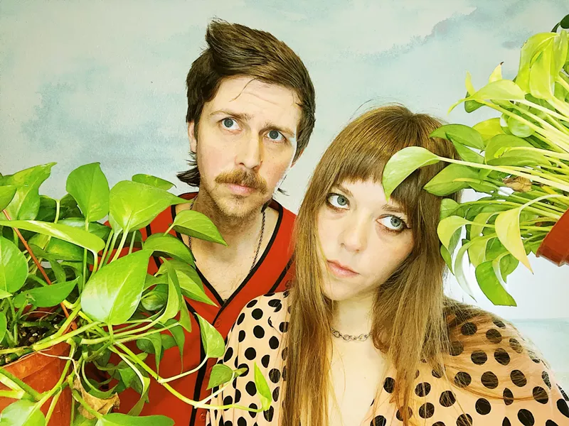 Image: A man and a woman in a band.