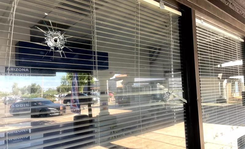 Image: bullet holes in a window