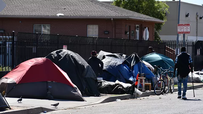Homeless people live in tents along Madison Street