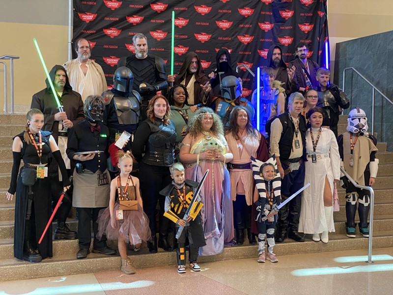 "Star Wars" cosplayers pose for a photo inside the Phoenix Convention Center's West Building during Fan Fusion 2024.