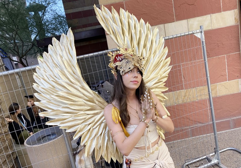 A local cosplayer who portrayed a golden angel at Phoenix Fan Fusion 2024.